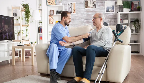 Preventing DVT with SCD devices – patient wearing sequential compression device on legs during post-surgery recovery showing how SCD therapy effectively prevents deep vein thrombosis and dangerous blood clots in hospital and home care patients