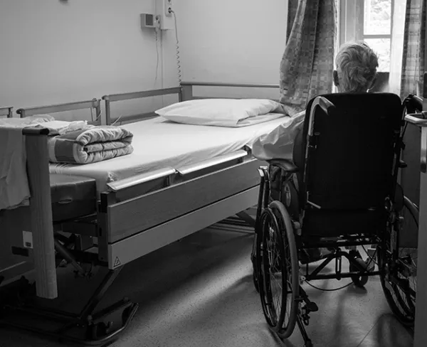 Elderly care services – trained caregiver assisting senior citizen at home for daily health and personal needs