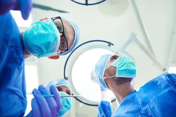 Empowering patients and caregivers with accessible and affordable high quality medical equipment – trained caregiver confidently assisting home patient with hospital grade rental equipment for effective recovery and long-term care in the comfort of home