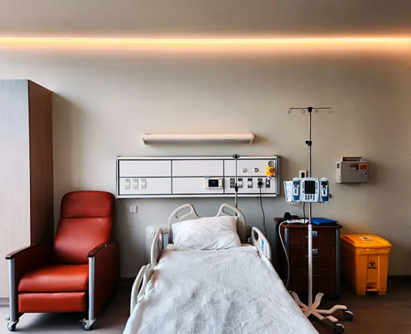 Home patient care services – professional nurse assisting elderly patient at home for daily medical needs